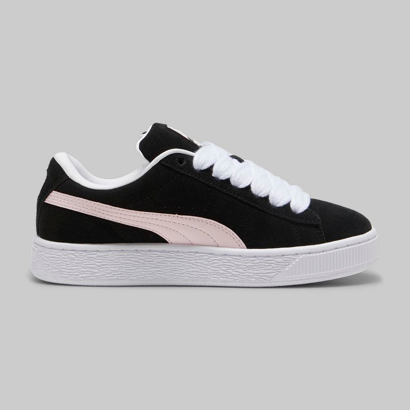 PUMA Suede XL sneakers with a full suede upper, leather Formstrip, exaggerated padded collar and tongue, and chunkier sole.