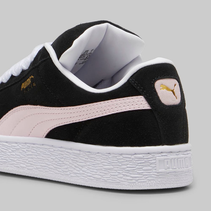 PUMA Suede XL sneakers with a full suede upper, leather Formstrip, exaggerated padded collar and tongue, and chunkier sole.