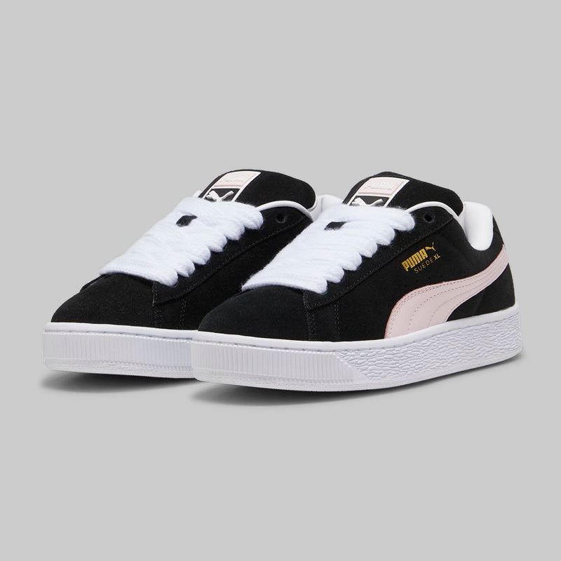 PUMA Suede XL sneakers with a full suede upper, leather Formstrip, exaggerated padded collar and tongue, and chunkier sole.