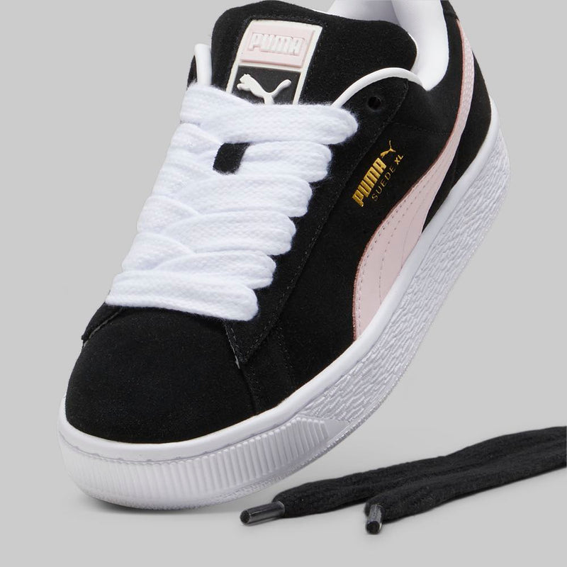 PUMA Suede XL sneakers with a full suede upper, leather Formstrip, exaggerated padded collar and tongue, and chunkier sole.