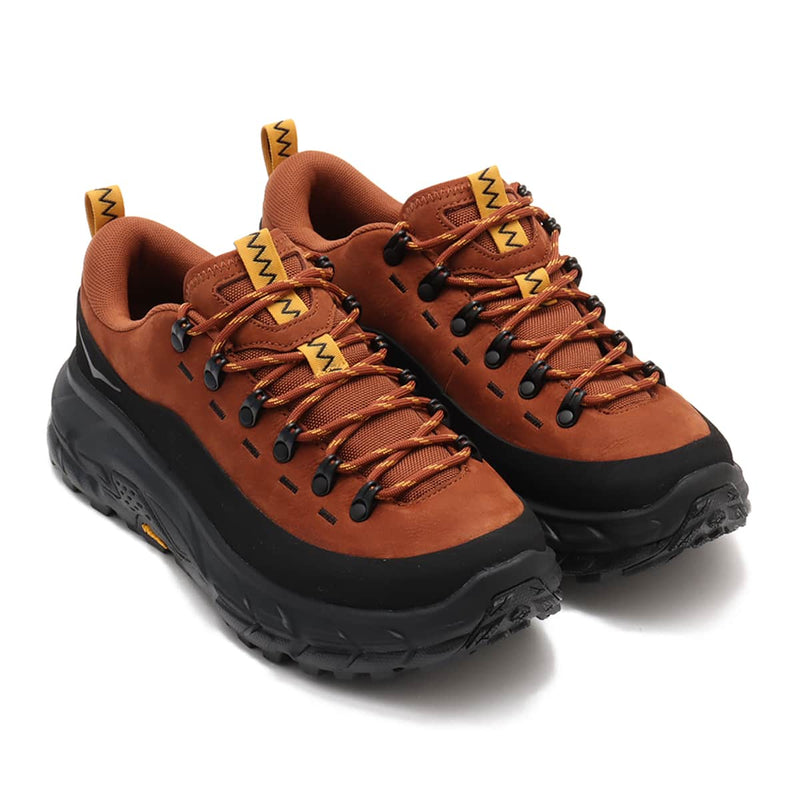 Hoka Tor Summit hiking shoes with nubuck leather, rubber mudguard, and metal eyelets, blending alpine boot design with urban style for enhanced durability and comfort.