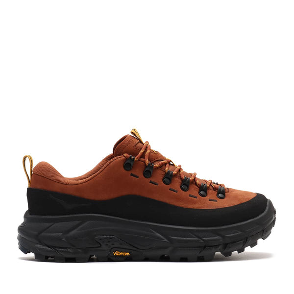 Hoka Tor Summit hiking shoes with nubuck leather, rubber mudguard, and metal eyelets, blending alpine boot design with urban style for enhanced durability and comfort.