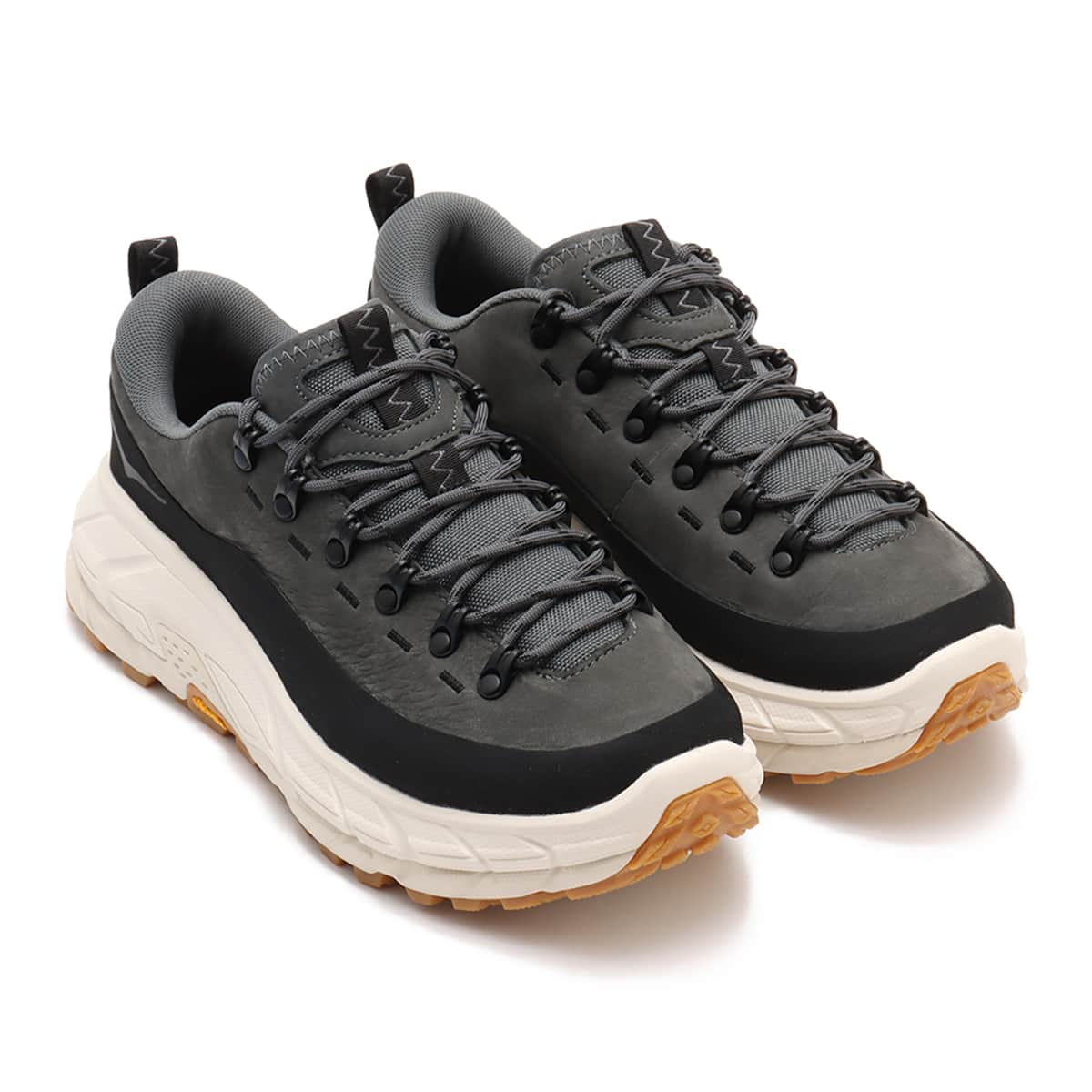 Hoka Tor Summit hiking shoes with nubuck leather, rubber mudguard, and metal eyelets, blending alpine boot design with urban style for enhanced durability and comfort.