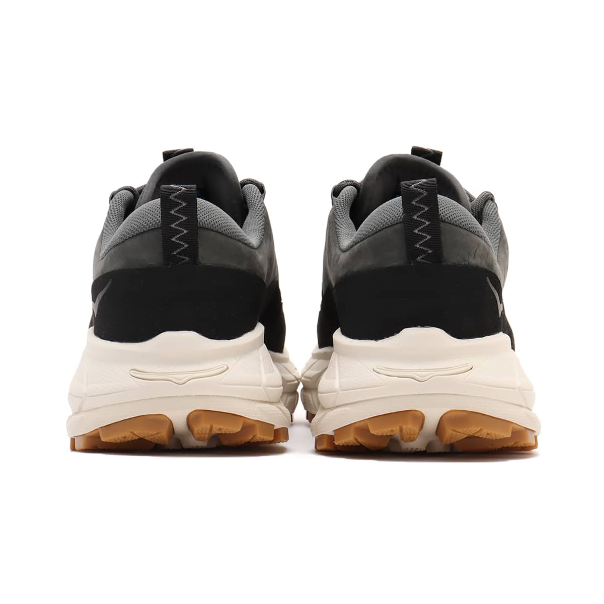 Hoka Tor Summit hiking shoes with nubuck leather, rubber mudguard, and metal eyelets, blending alpine boot design with urban style for enhanced durability and comfort.