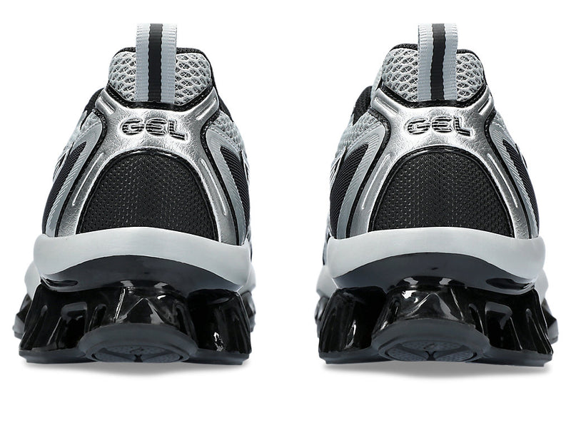 ASICS GEL-QUANTUM KINETIC™ sneaker showcasing a layered upper with synthetic leathers and mesh panels, and a midsole with Scutoid GEL™ technology for enhanced comfort and shock absorption.