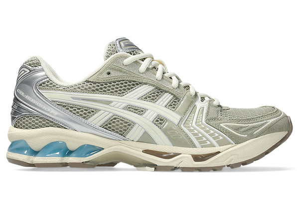 Julia Salazar x ASICS GEL-Kayano 14 sneaker with a mix of Vanilla Ice, Eucalyptus, and cyan blue accents, featuring the "Sound Mind, Sound Body" motto on the interior.