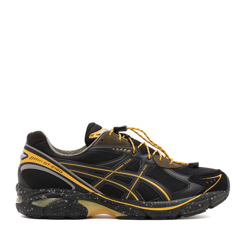 atmos x GRIPSWANY x ASICS SportStyle GT-2160 sneakers featuring a black upper with Swany Yellow ASICS stripes, drawstring laces, reflective details, and a duck camo insole.