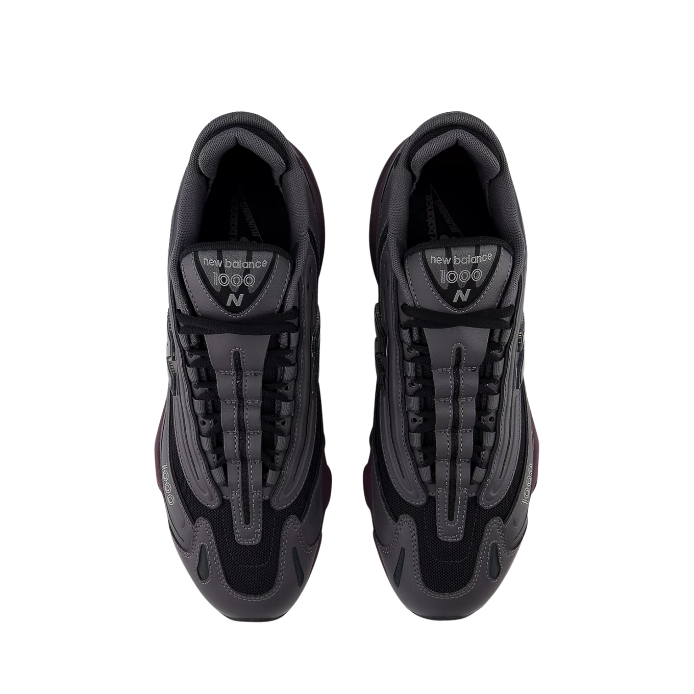 New Balance "Grey Day" inspired grey and black sneaker with plum midsole, leather and mesh construction, and signature "N" logo.