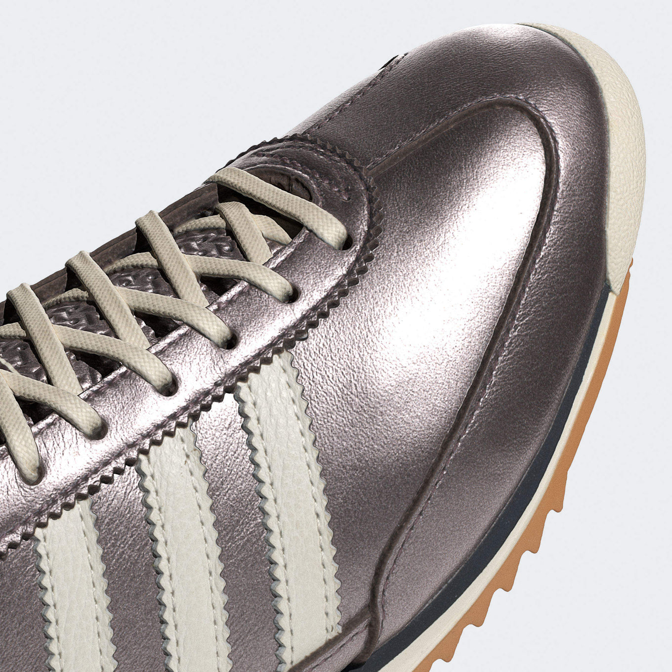 adidas SL 72 sneaker with a metallic leather upper, low-profile silhouette, and EVA midsole for lightweight comfort and vintage-inspired style.