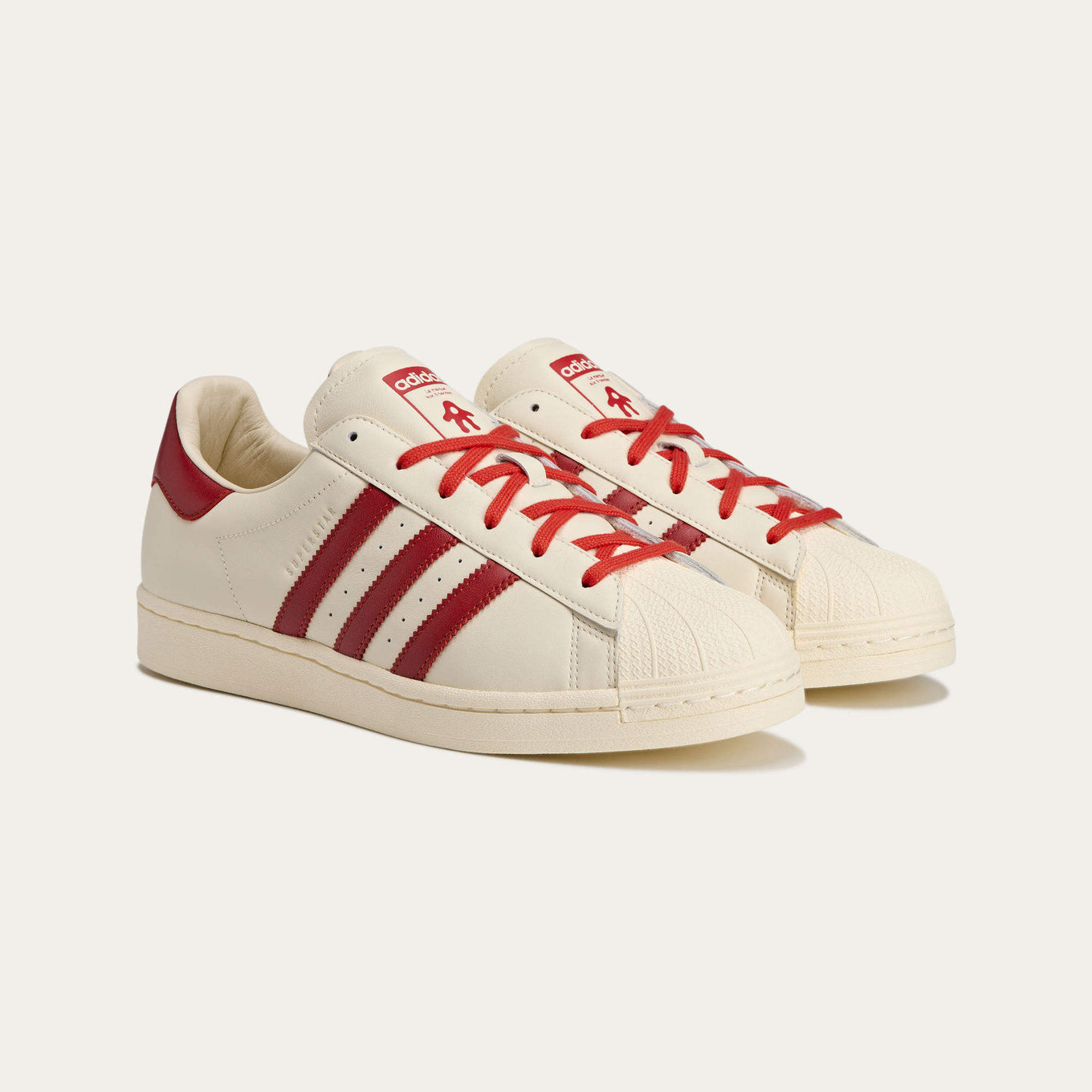 AVAVAV x adidas Originals Superstar sneaker featuring oversized, finger-like extensions on the shell toe with signature three stripes and co-branded details.