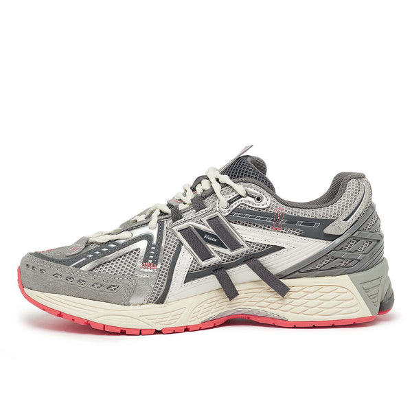 New Balance U1906AA sneaker with grey mesh upper, beige and brown overlays, NLock Lacing system, and cushioned sole with N-Ergy and ABZORB SBS pods.