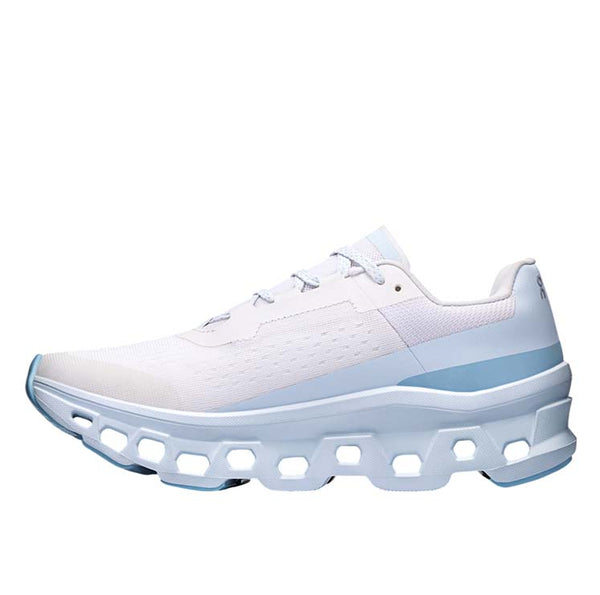 On Cloudmonster WMNS Frost / Wash running shoe with CloudTec cushioning, combining icy blue and neutral tones for a stylish, comfortable design.