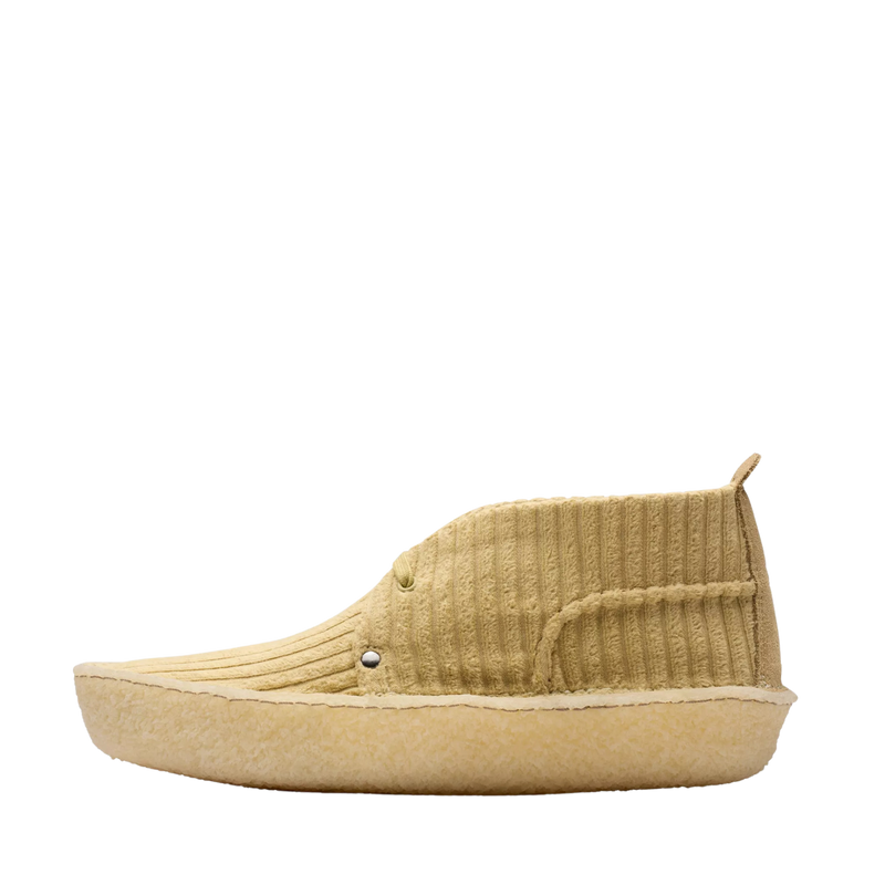 Clarks Originals shoe with premium maple cord upper, round tonal laces, metallic logo, and natural crepe sole wrapping heel and toe.