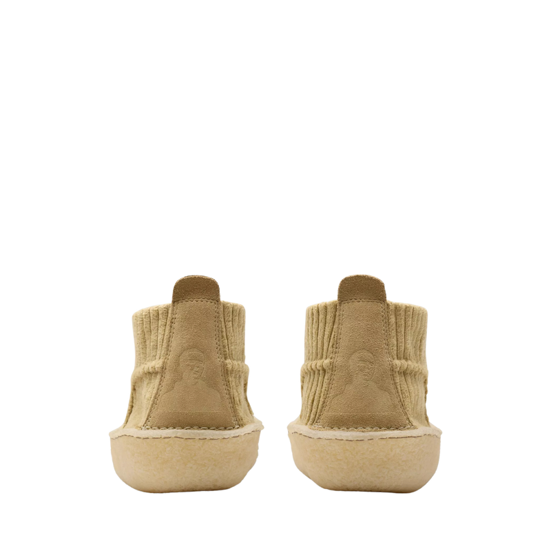 Clarks Originals shoe with premium maple cord upper, round tonal laces, metallic logo, and natural crepe sole wrapping heel and toe.