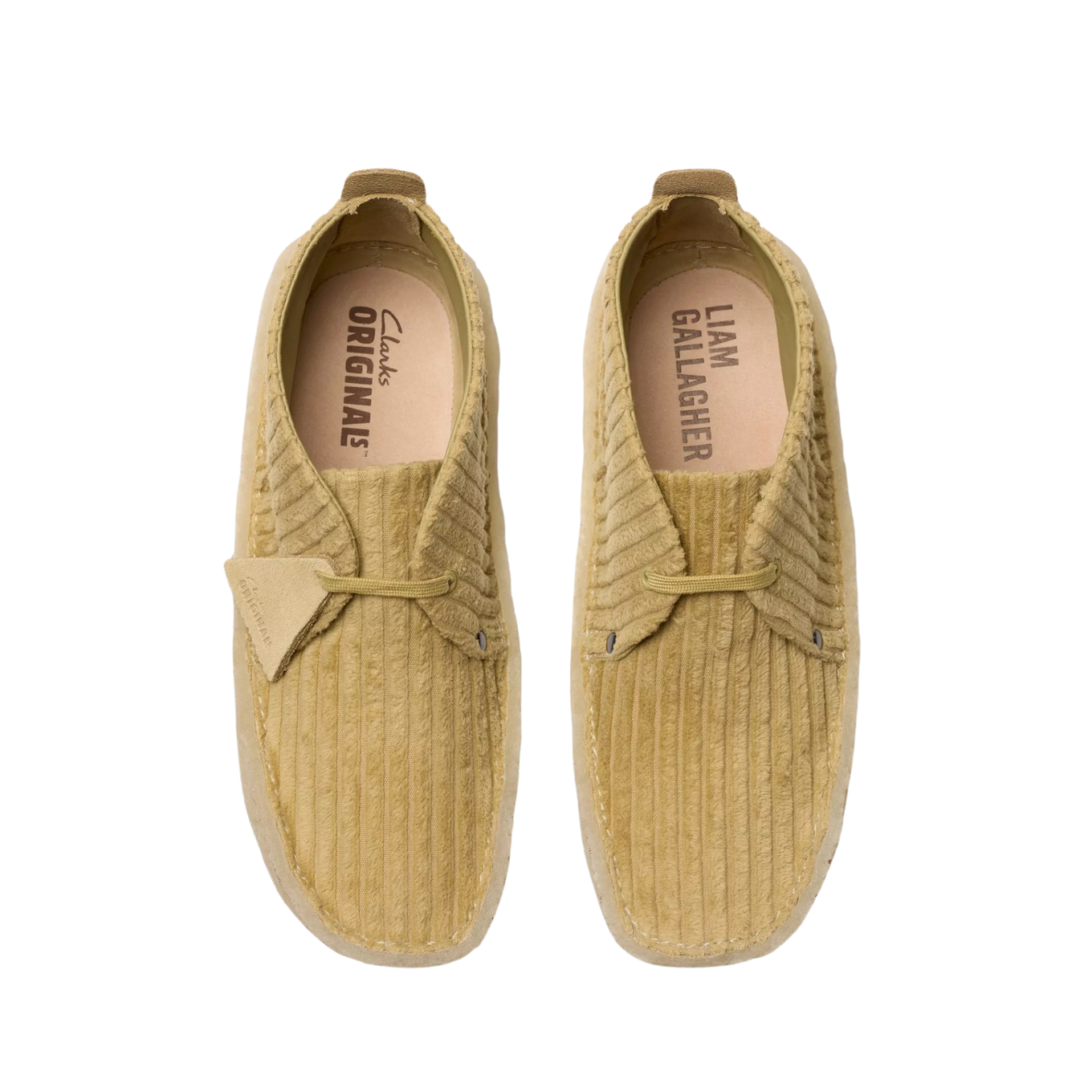 Clarks Originals shoe with premium maple cord upper, round tonal laces, metallic logo, and natural crepe sole wrapping heel and toe.