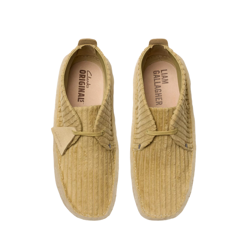 Clarks Originals shoe with premium maple cord upper, round tonal laces, metallic logo, and natural crepe sole wrapping heel and toe.