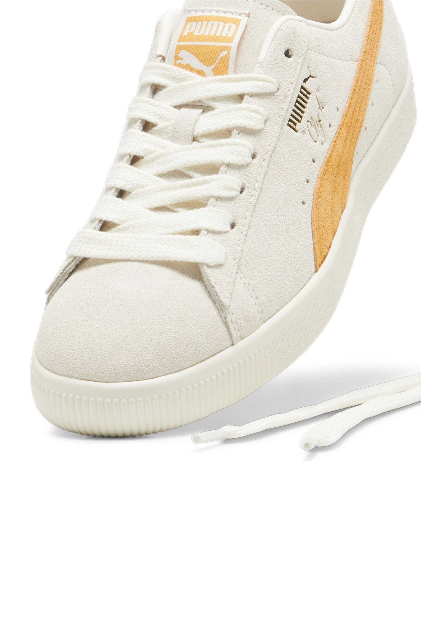 Clyde sneaker celebrating 50 years with suede upper, inspired by basketball icon Walt 'Clyde' Frazier.