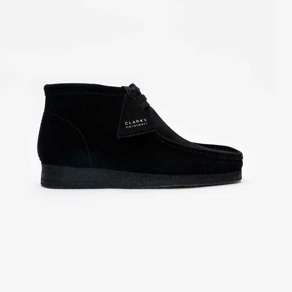 Clarks Wallabee in black suede with a structured moccasin design and signature crepe sole.


