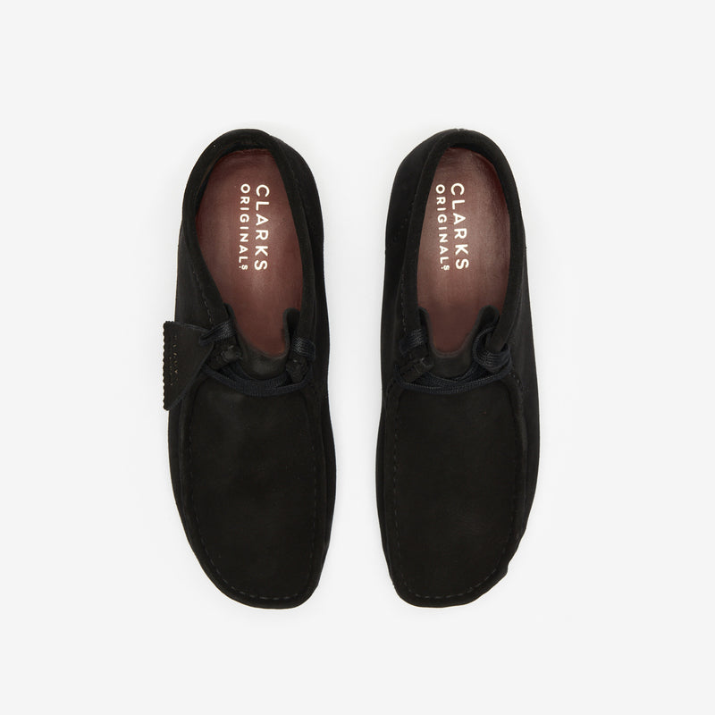 Clarks Wallabee in black suede with a structured moccasin design and signature crepe sole.


