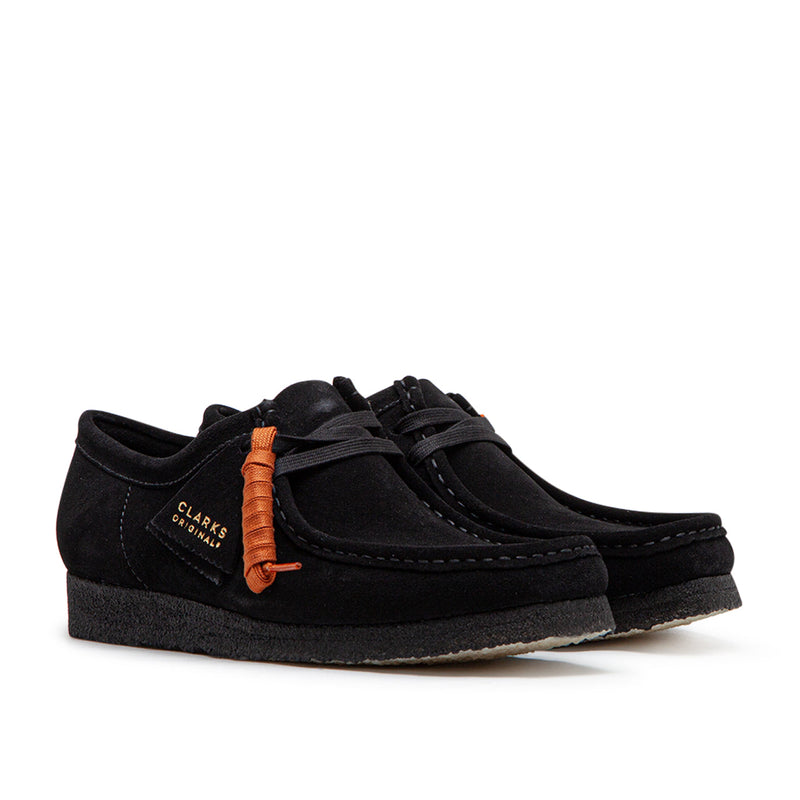 Clarks Wallabee in black suede with a structured moccasin design and signature crepe sole.