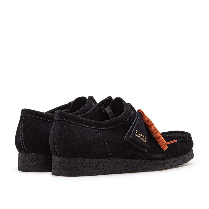 Clarks Wallabee in black suede with a structured moccasin design and lace-up closure.


