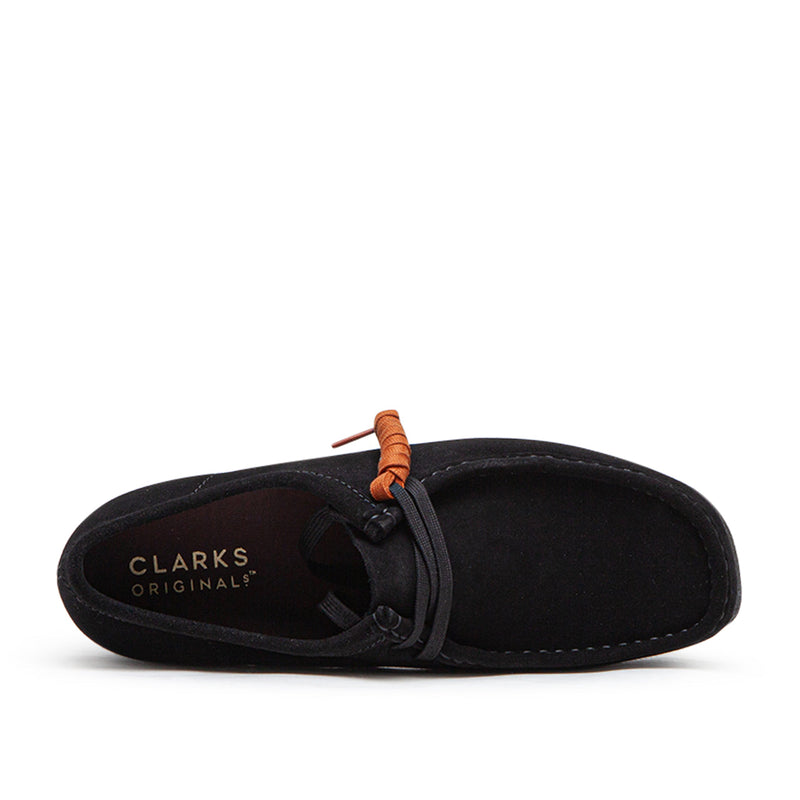 Clarks Wallabee in black suede with a structured moccasin design and lace-up closure.


