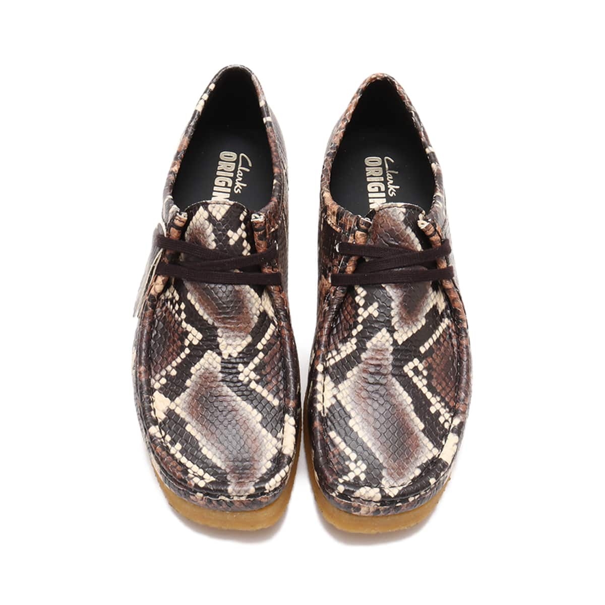 Clarks Wallabee shoe in bold brown snake print with round toe and crepe sole
