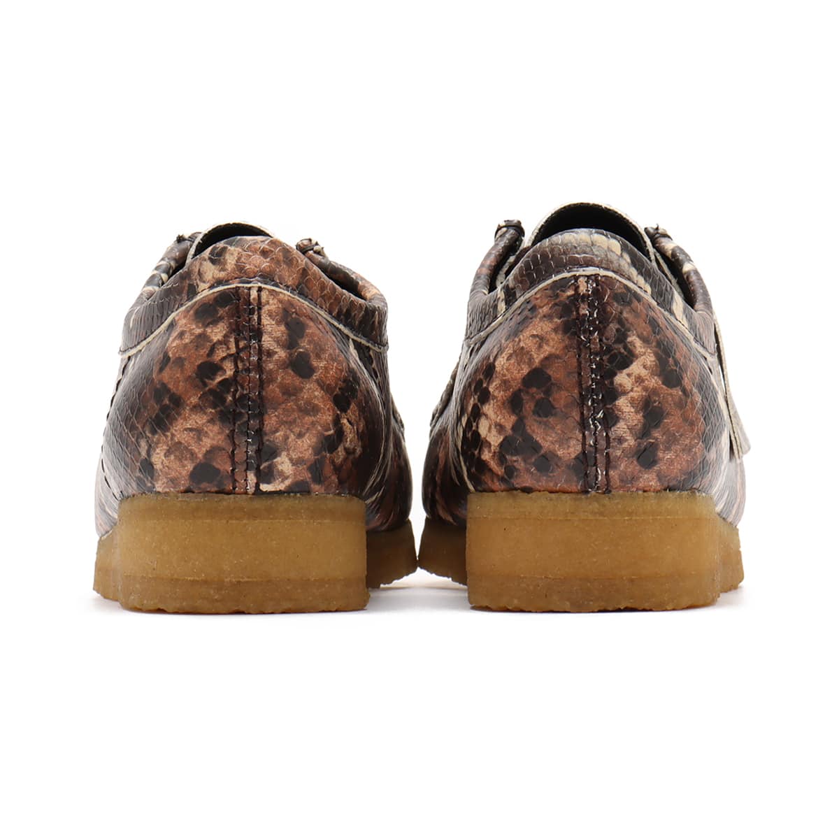 Clarks Wallabee shoe in bold brown snake print with round toe and crepe sole