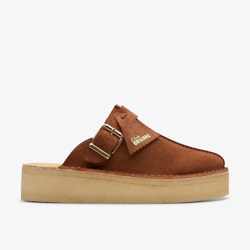 Clarks Originals Trek Wedge Mule in mocha bisque suede with metal buckles, showcasing a central butt seam and natural crepe rubber soles