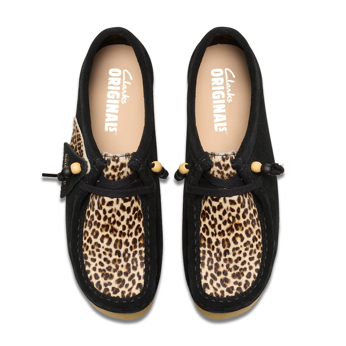 Enhanced Wallabee moccasins with thick sole, 4.5cm heel, and vintage beaded decoration on shoelace, showcasing a stylish moccasin silhouette.