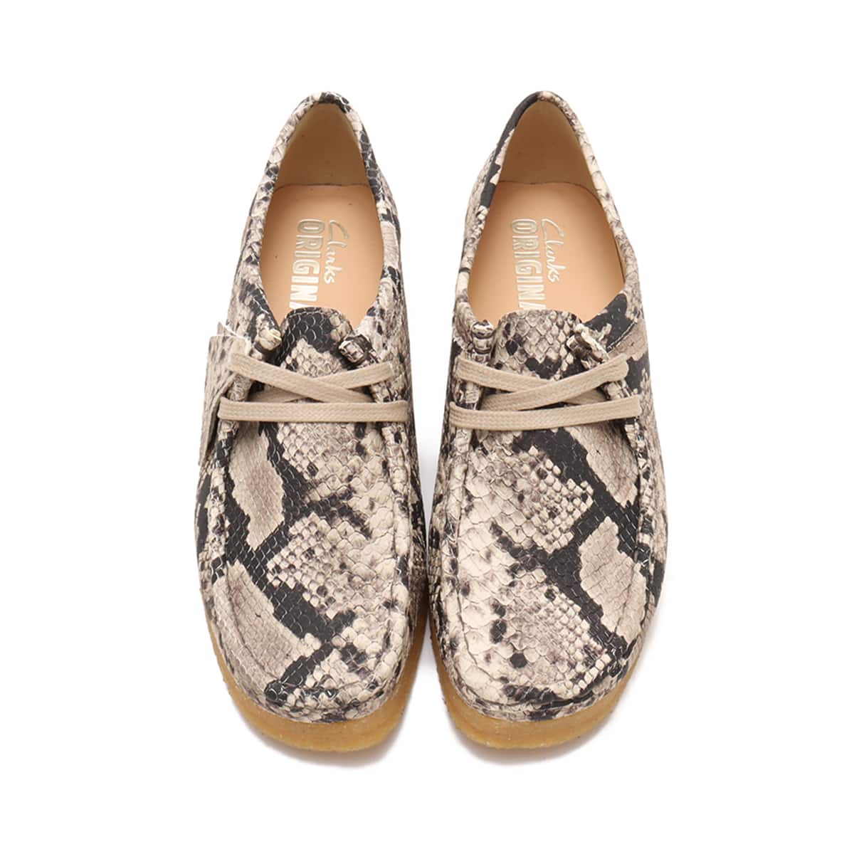 Grey snake leather Clarks Wallabee shoe with classic lace-up design and crepe sole