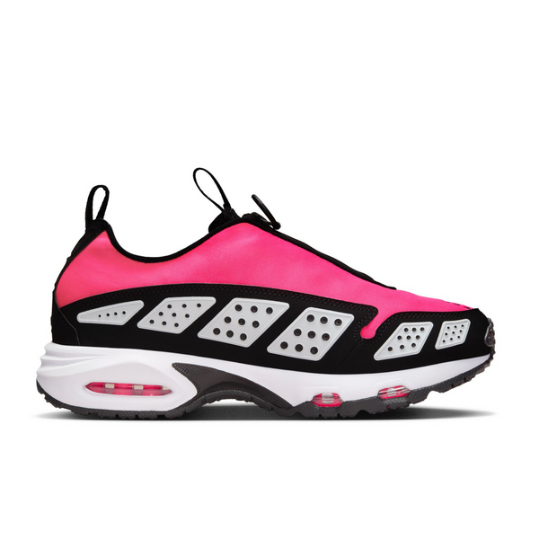 Air Max SNDR sneaker featuring a bold color scheme with black overlays, Hyper Pink shroud, and reflective white panels, equipped with Max Air and Nike Air cushioning. Unzipped shroud reveals "6453," referencing Nike's global office numbers.



