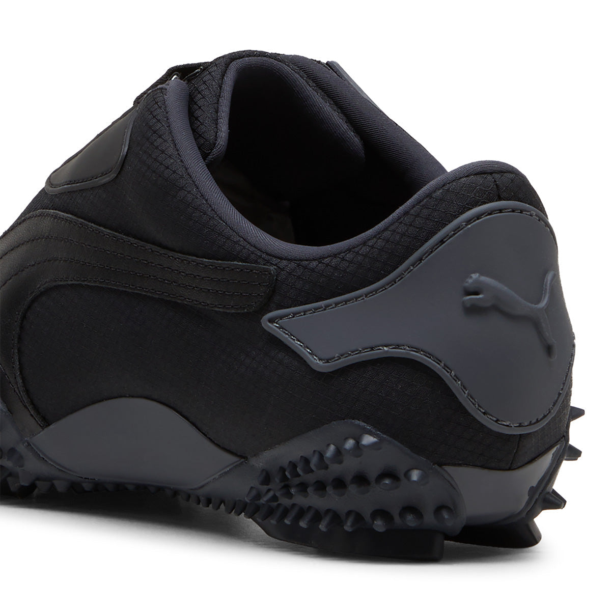 PUMA classic low-profile shoe with spiky sole and hook-and-loop fastener, offering comfort and unique style.