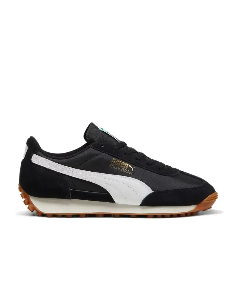 PUMA Easy Rider sneaker with textile base and suede leather overlays, showcasing sleek profile and vintage appeal.