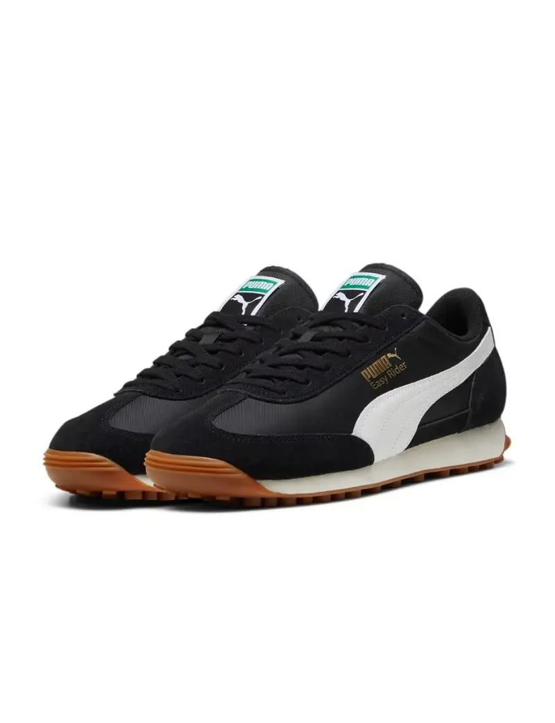 PUMA Easy Rider sneaker with textile base and suede leather overlays, showcasing sleek profile and vintage appeal.