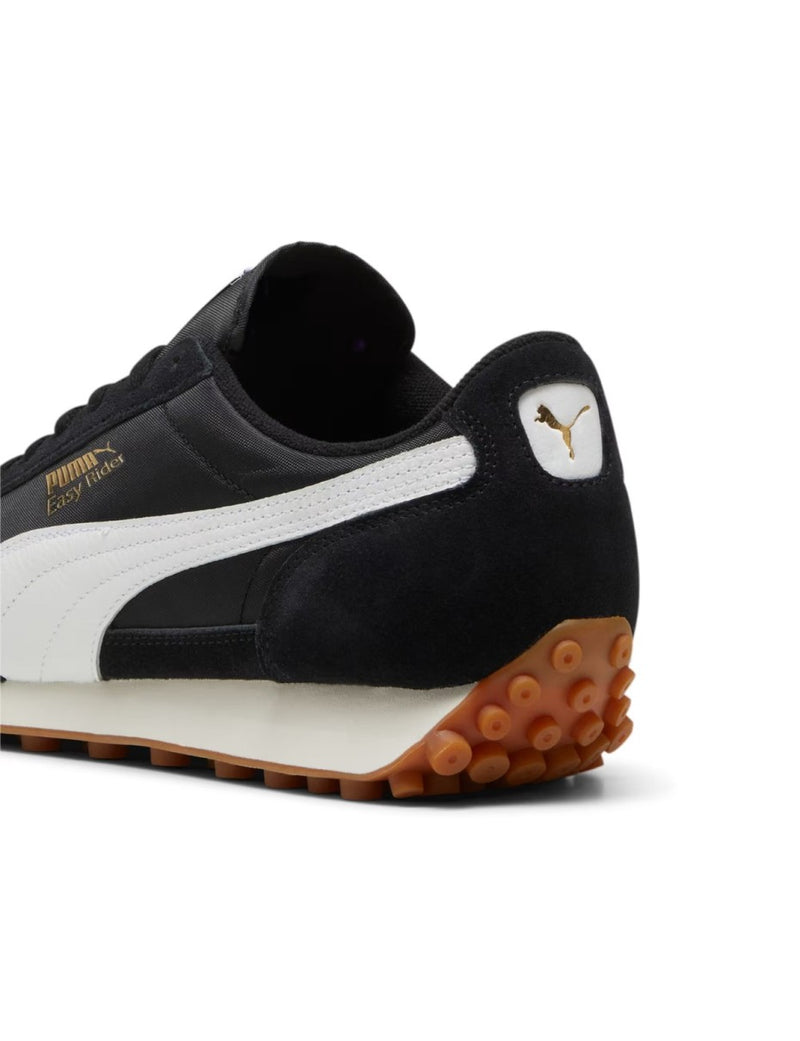 PUMA Easy Rider sneaker with textile base and suede leather overlays, showcasing sleek profile and vintage appeal.