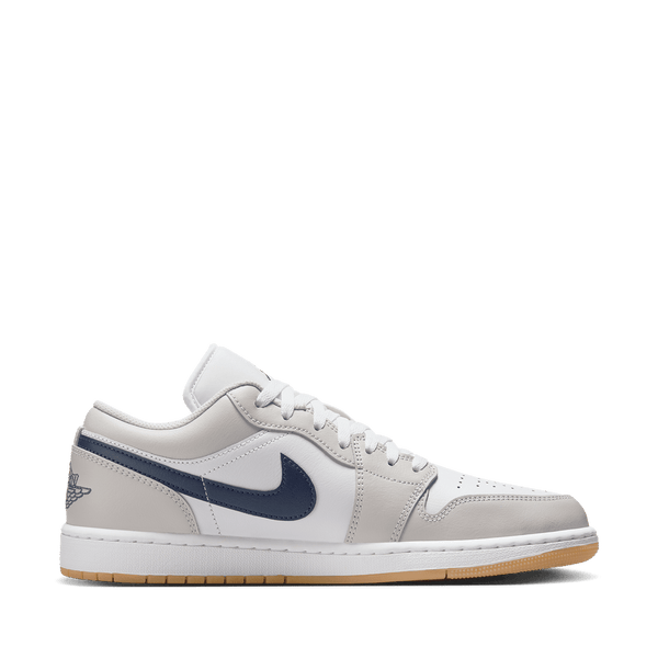 Air Jordan 1 Low sneakers in classic colorway, side profile view.