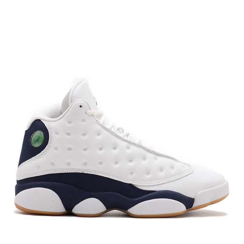 Air Jordan 13 '97-'98 retro in white and Midnight Navy with quilted overlay, sculpted midsole, and holographic eye