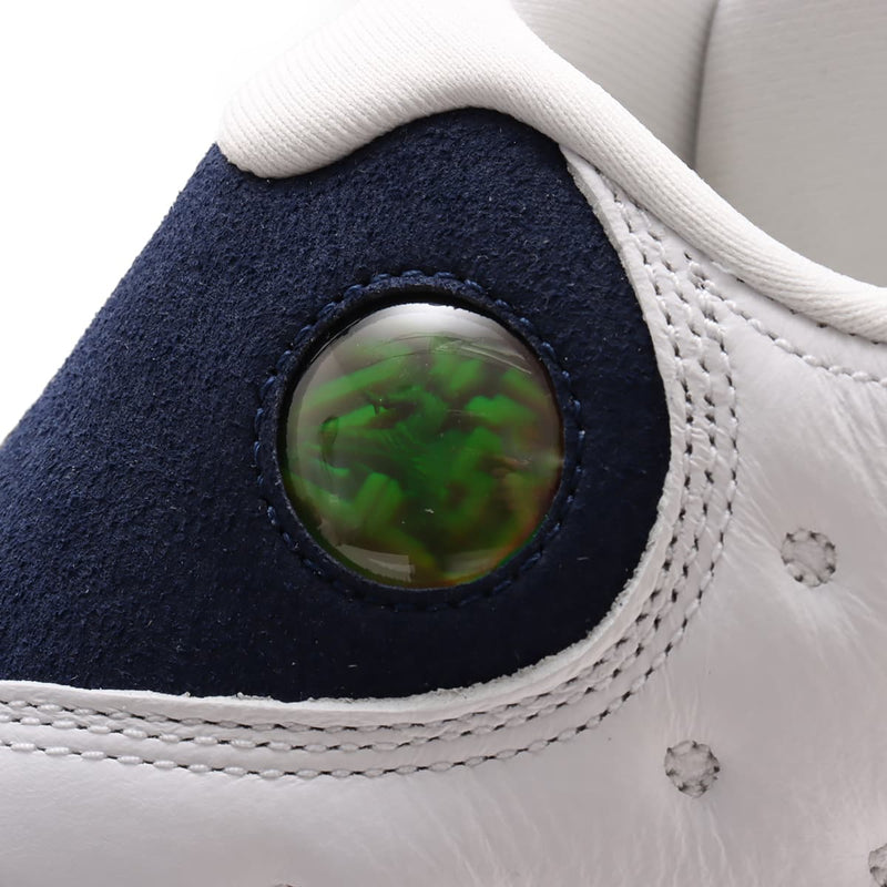 Air Jordan 13 '97-'98 retro in white and Midnight Navy with quilted overlay, sculpted midsole, and holographic eye