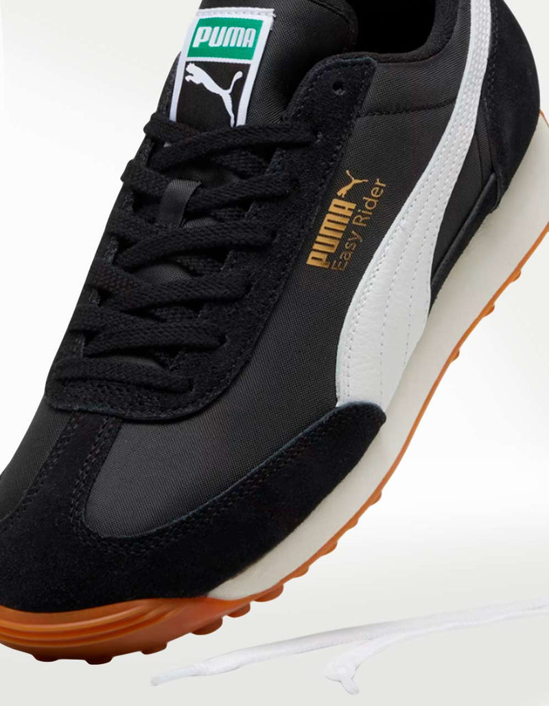 PUMA Easy Rider sneaker with textile base and suede leather overlays, showcasing sleek profile and vintage appeal.