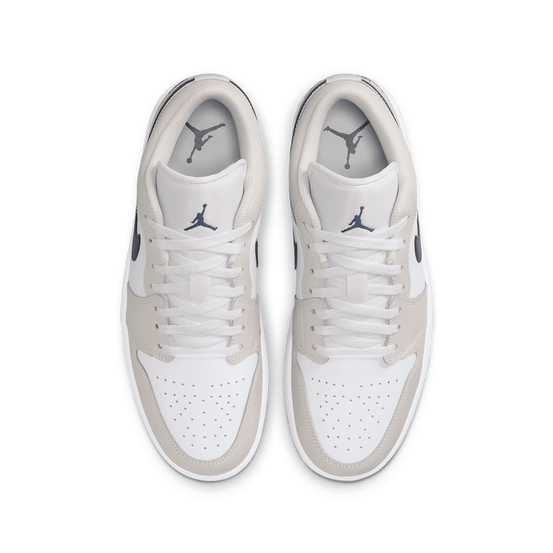 Air Jordan 1 Low sneakers in classic colorway, side profile view.