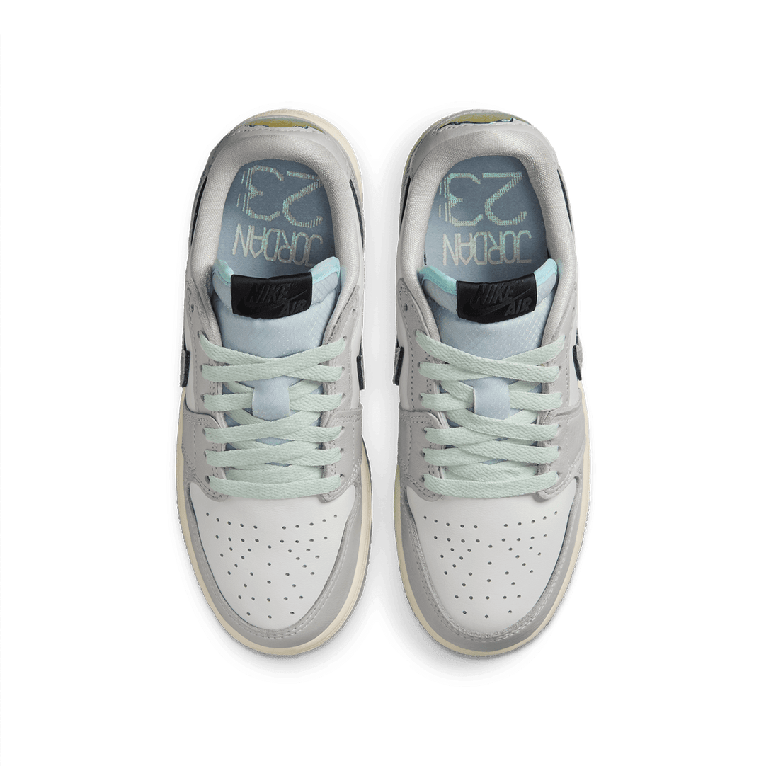 Air Jordan ‘Year of the Snake’ sneaker with reptilian-inspired textures, intricate patterns, and genuine leather for a luxe, commemorative design.