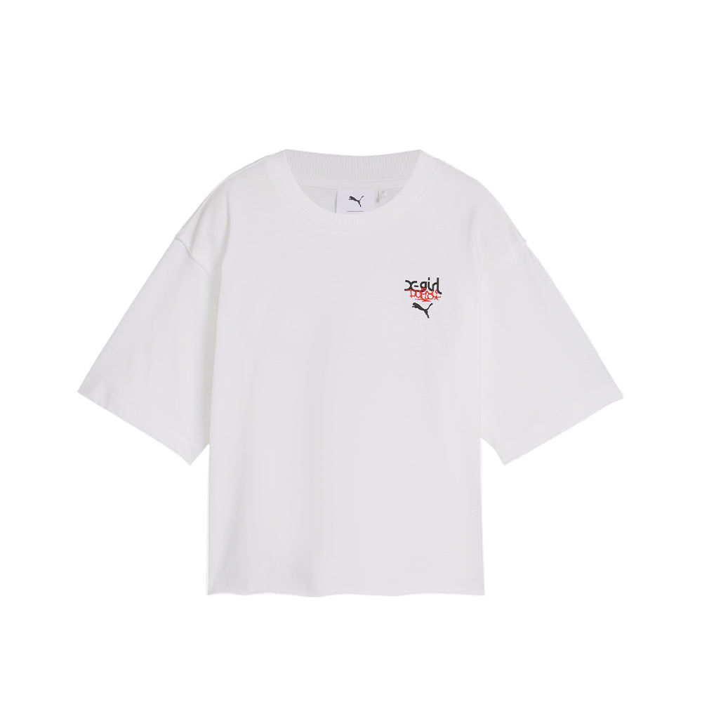 PUMA x X-GIRL tee featuring bold rubber print graphic on the front and contrast stitching, showcasing a modern streetwear style with a graffiti-inspired, DIY vibe.