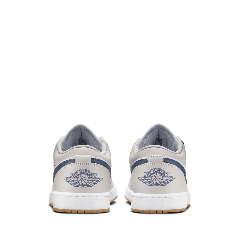Air Jordan 1 Low sneakers in classic colorway, side profile view.