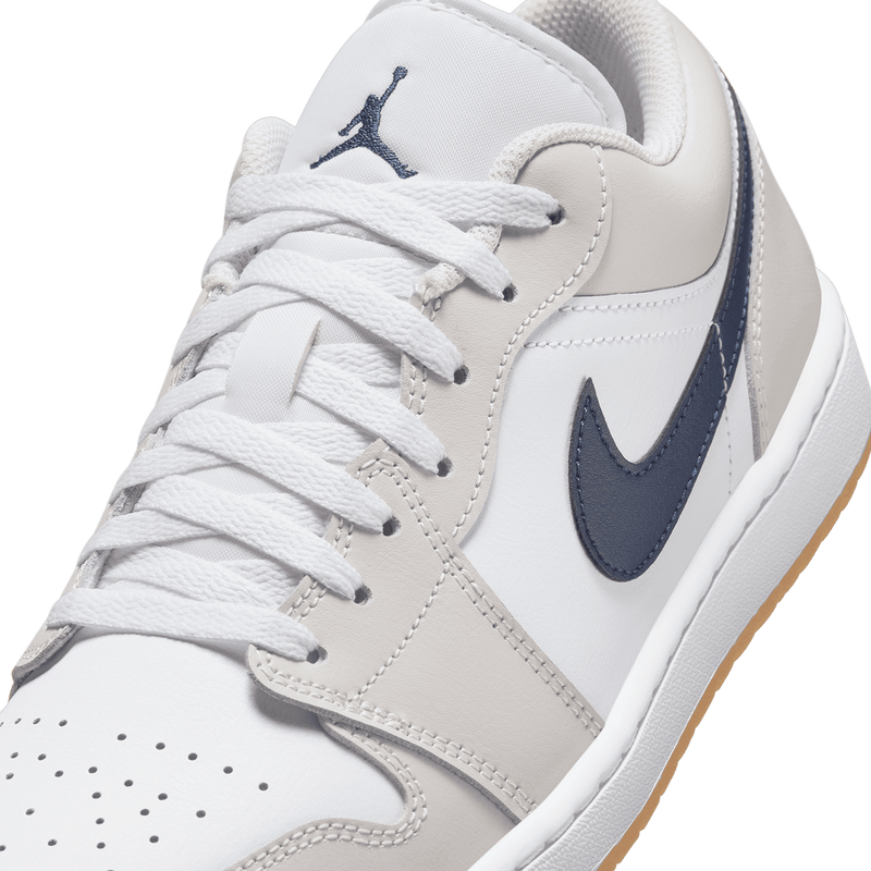 Air Jordan 1 Low sneakers in classic colorway, side profile view.