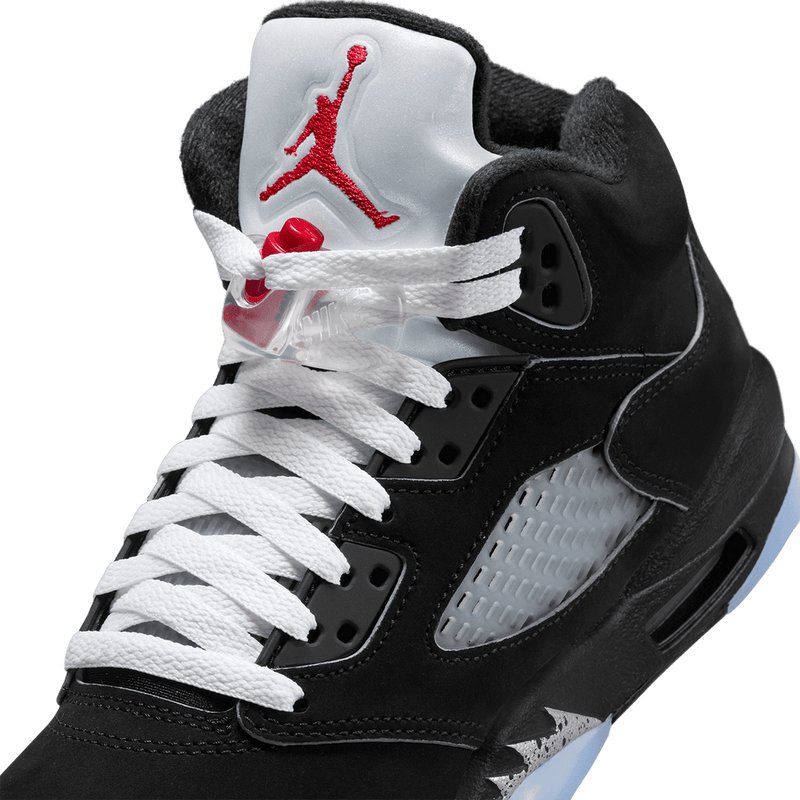 Air Jordan 5 sneaker with zig-zag midsole details, mesh panels, lace locks, and premium nubuck leather with metallic accents.