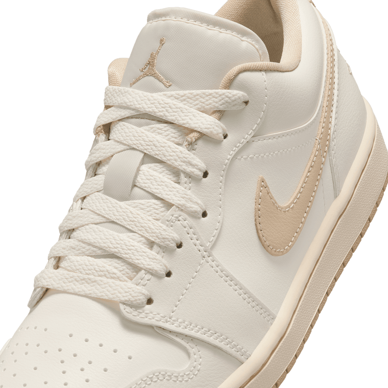 Air Jordan 1 Low sneakers featuring classic silhouette, premium materials, and encapsulated Air unit in the heel.