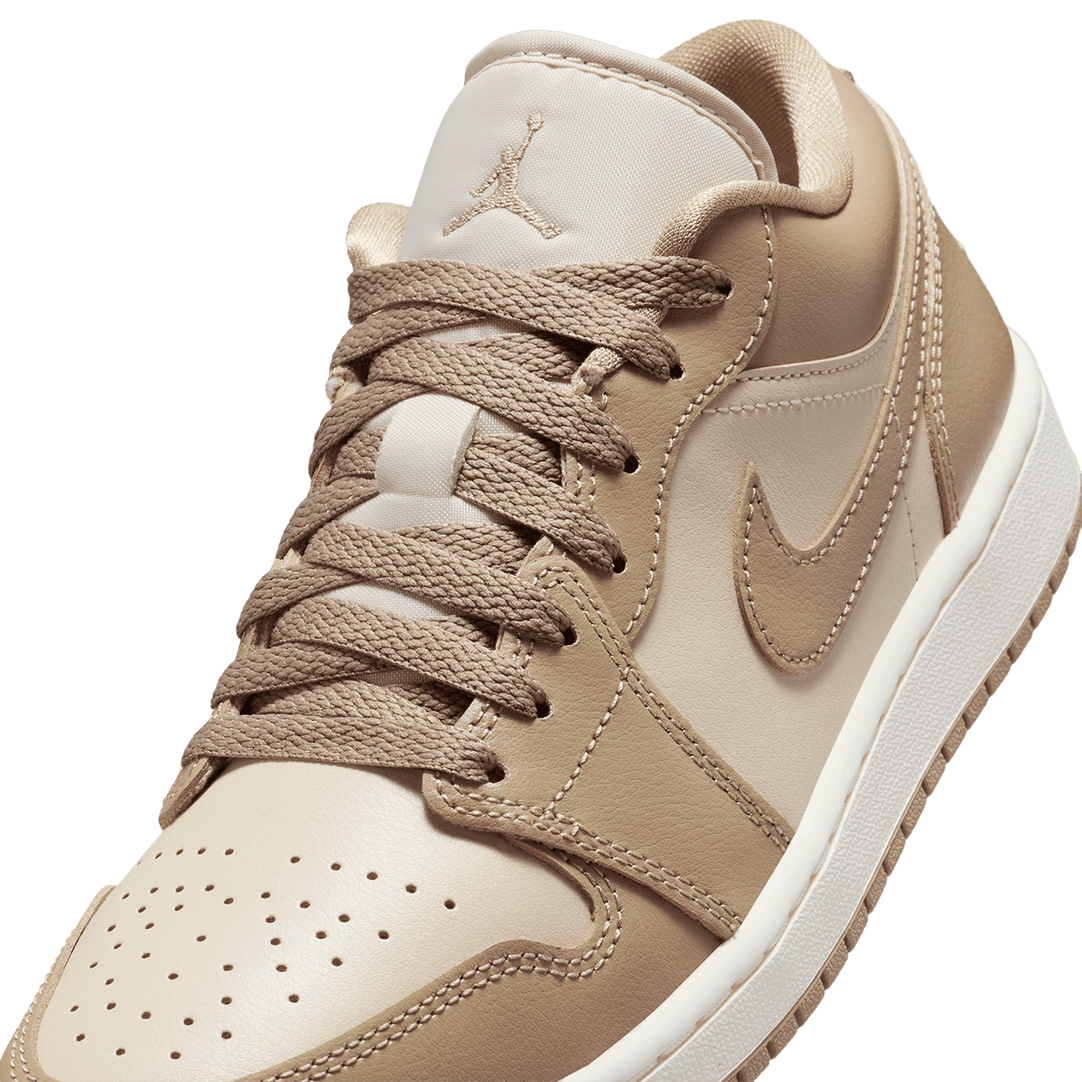 Air Jordan 1 Low sneaker with a premium material mix, iconic design, and encapsulated Air cushioning for all-day comfort.