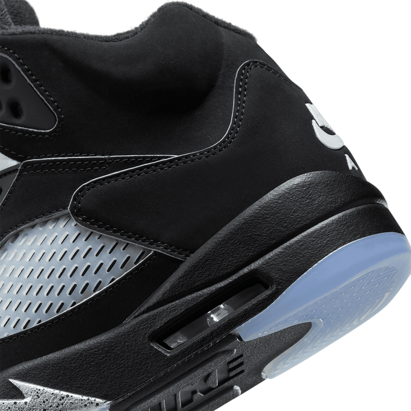 Air Jordan 5 sneaker with zig-zag midsole details, mesh panels, lace locks, and premium nubuck leather with metallic accents.