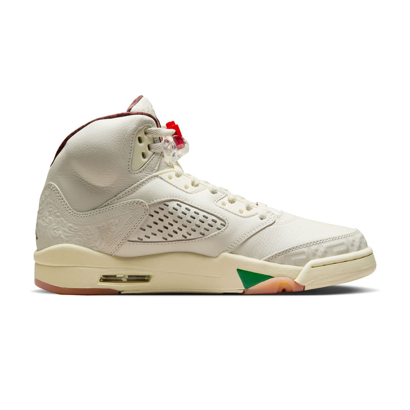 Exclusive AJ5 sneakers celebrating Mexico's heritage, featuring laser-cut leather, embossed patterns, asymmetrical midsole flames, off-white leather, and red and green lace locks, with a "VIVA" dubrae.


